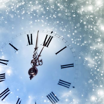 Old clock with stars snowflakes and holiday lights