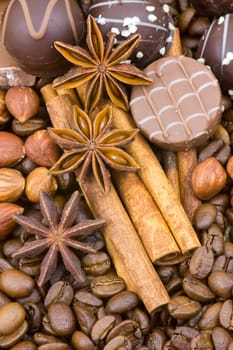 background with chocolate, coffee, spices and nuts