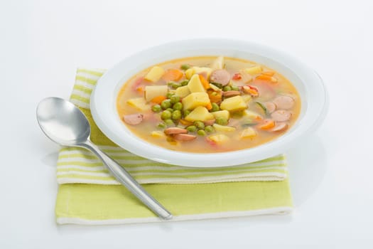Vegetable soup with sausages