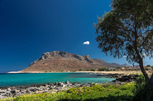The famous beach where Anthony Quinn danced the most famous musical piece of Mikis Theodorakis in the film "Zorba the greek"""