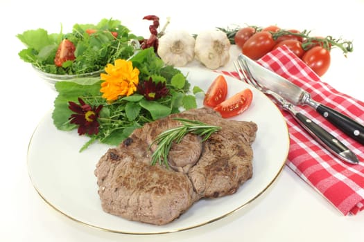 a fried entrecote with wild herb salad