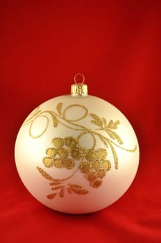 christmas ball isolated on red background