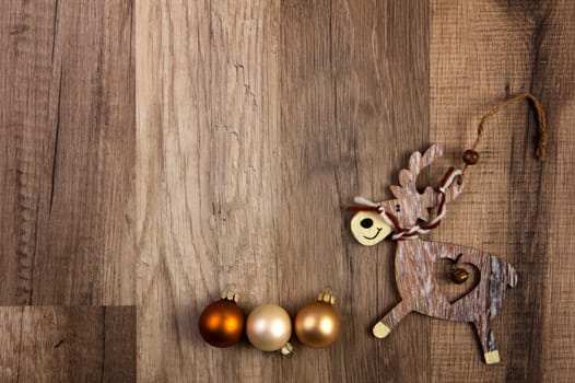 Christmas baubles bronze,white,cream with moose and wooden background