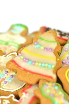 Delicious decorated Christmas cookies isolated on white background
