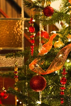 Decorated christmas tree and stained glass window - vertical