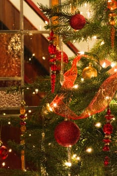 Decorated christmas tree and stained glass window - vertical
