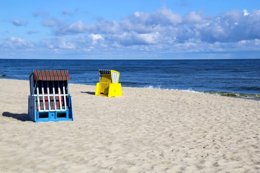Empty roofed wicker beach chairs at the Usedom beach
