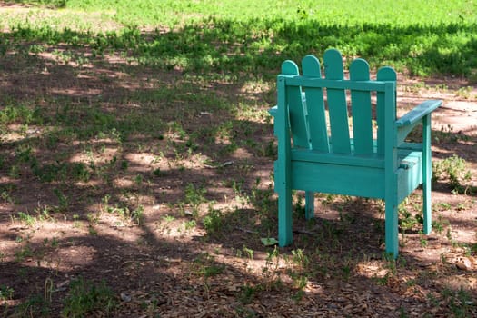 One deck chair in the shadow during a sunny day