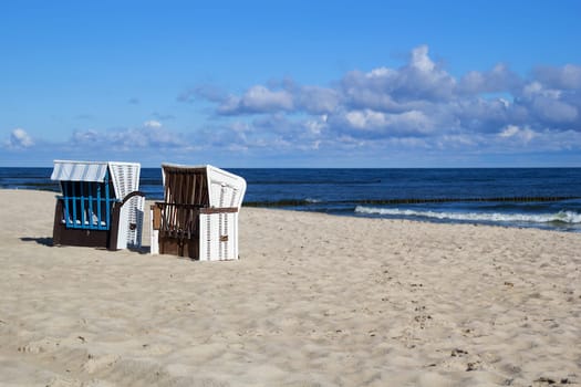 Empty roofed wicker beach chairs at the Usedom beach