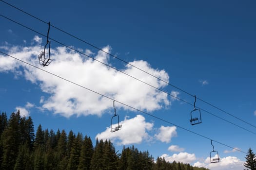 Empty ski lift seats from below