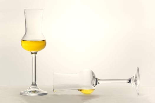 Two partly filled Grappa glasses very bright lightened