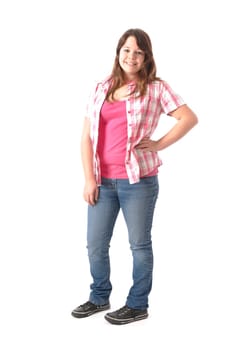 Girl with long dark hair wears a checkered blouse and jeans,stands in front of a white background