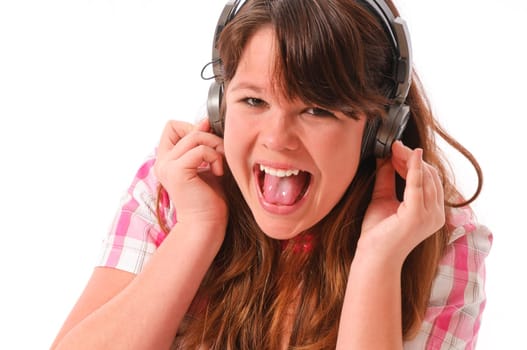Young mGirl with long dark hair listens enthusiastically to music with headphones against a white background.