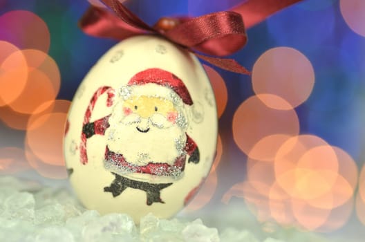 Christmas bauble  made by decoupage technique on bokeh background