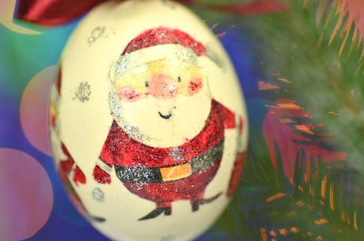 Christmas bauble  made by decoupage technique on bokeh background