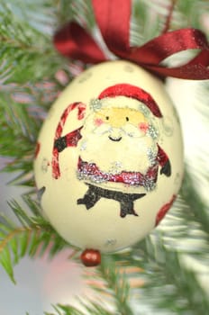 Christmas bauble  made by decoupage technique on bokeh background