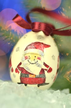 Christmas bauble  made by decoupage technique on bokeh background
