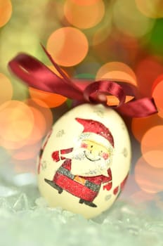 Christmas bauble  made by decoupage technique on bokeh background