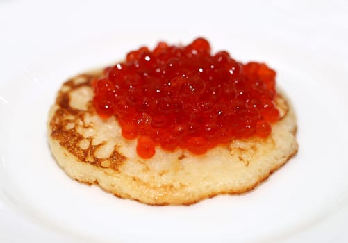 Pancake with red caviar