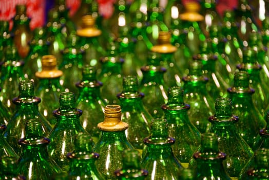 Empty green glass bottles, shallow depth of field