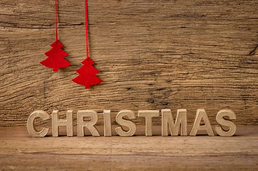 Christmas lettering against a rustic background