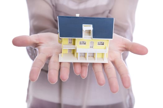The dream of owning a home - woman isolated with a property