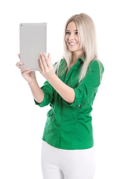 Young woman isolated in green blouse with tablet PC