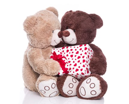 Teddy bears as lovers isolated with gift and red hearts