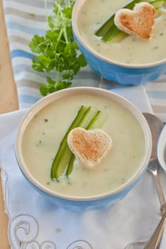 Creamy vegetable soup with cucumber and toasted white bread