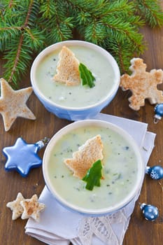 Creamy vegetable soup with cucumber and toasted white bread