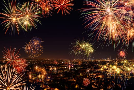 Vivid colorful fireworks over a city,seen from above