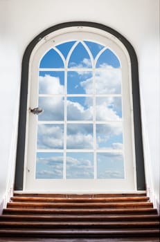 Conceptual image of a locked glass door with beautiful skies behind