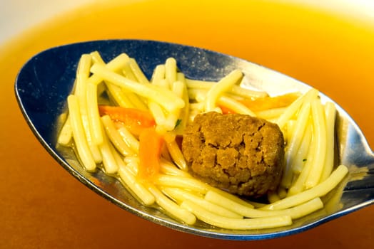 Beef broth with pasta and meatballs