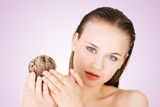 beautiful spa woman holding the rose of jericho