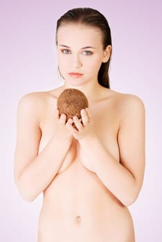beautiful woman with coconut in hands