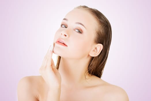 beautiful woman using cotton pad