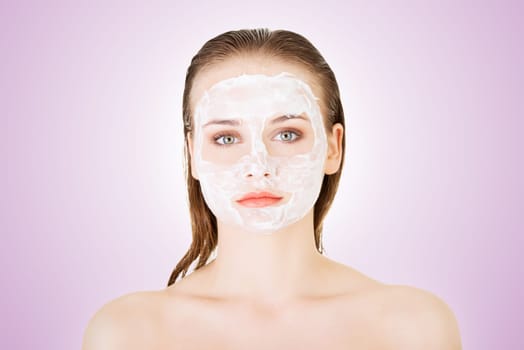 beautiful woman with clay facial mask