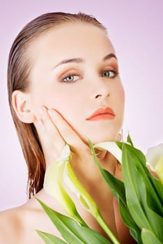 beauty face of the young beautiful woman with flower.