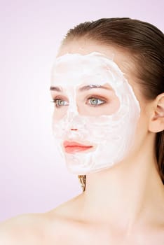 beautiful woman with clay facial mask