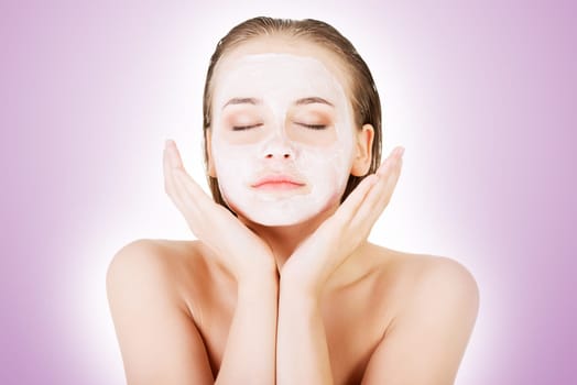 beautiful woman with clay facial mask