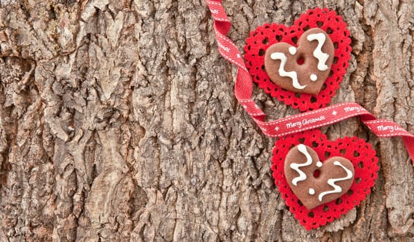 Rustic bark background with red hearts for Christmas