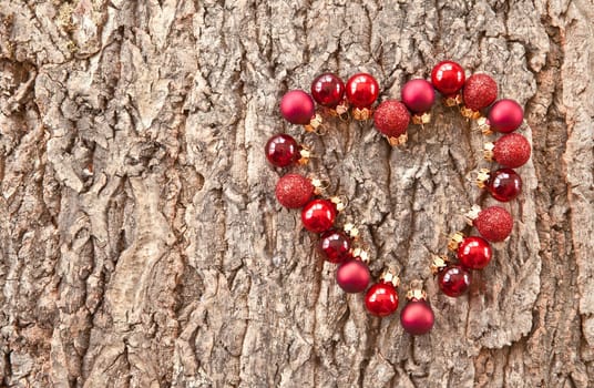 Rustic wooden background with colorful Christmas baubles for Christmas