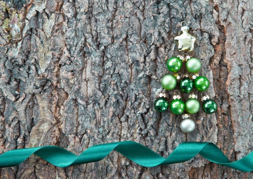 Rustic wooden background with colorful Christmas baubles for Christmas