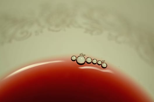Detail of a glass of red wine