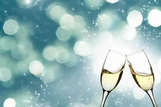 Glasses of champagne against holiday background