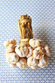 Bunch garlic isolated on background in kitchen