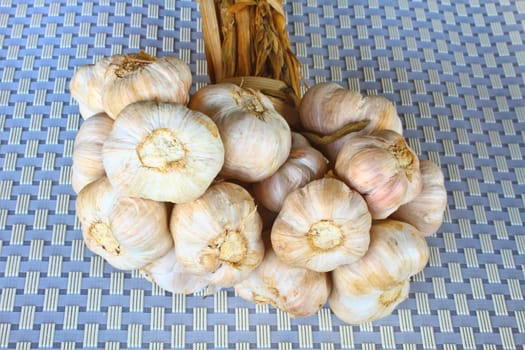Bunch garlic isolated on background in kitchen