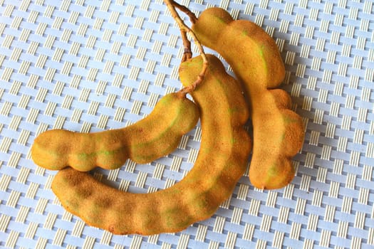 Bunch of Tamarind fruit isolated on background