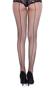 Beautiful legs with fishnet stockings from behind