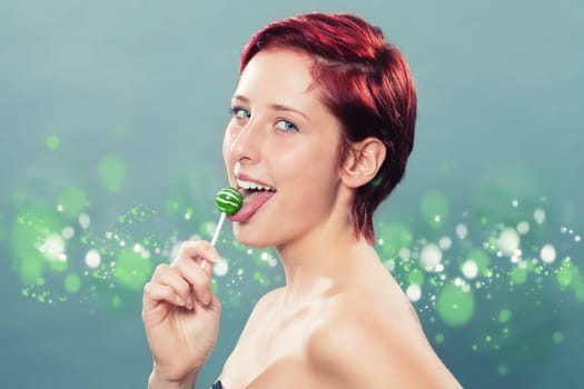Red-haired Beautiful Woman Licks Green Lollipop